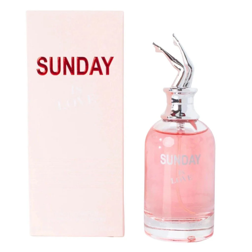 Sunday Is Love 100ml Eau de Parfum in a sleek transparent bottle with pink liquid and a silver high-heel cap, next to its soft pink retail box.
