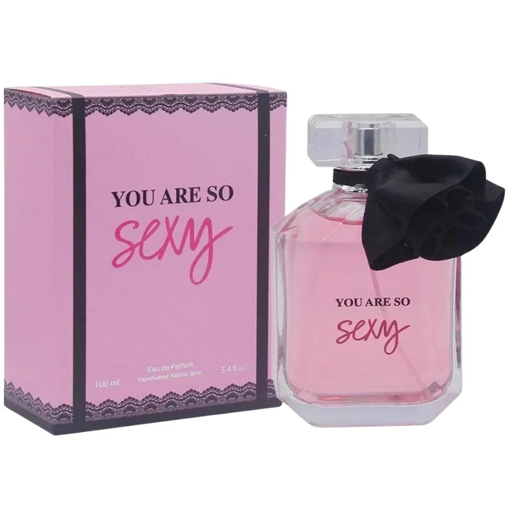 You Are So Sexy 100ml Eau de Parfum in a clear bottle with a black flower ribbon next to its pink lace-patterned box.