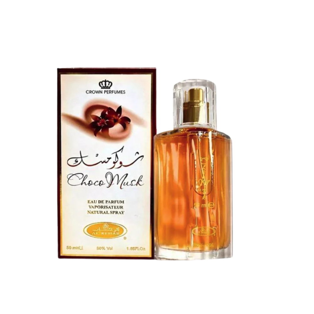 Choco Musk Eau De Parfum 50 ml clear glass bottle showing amber liquid standing next to its cream and brown retail box.