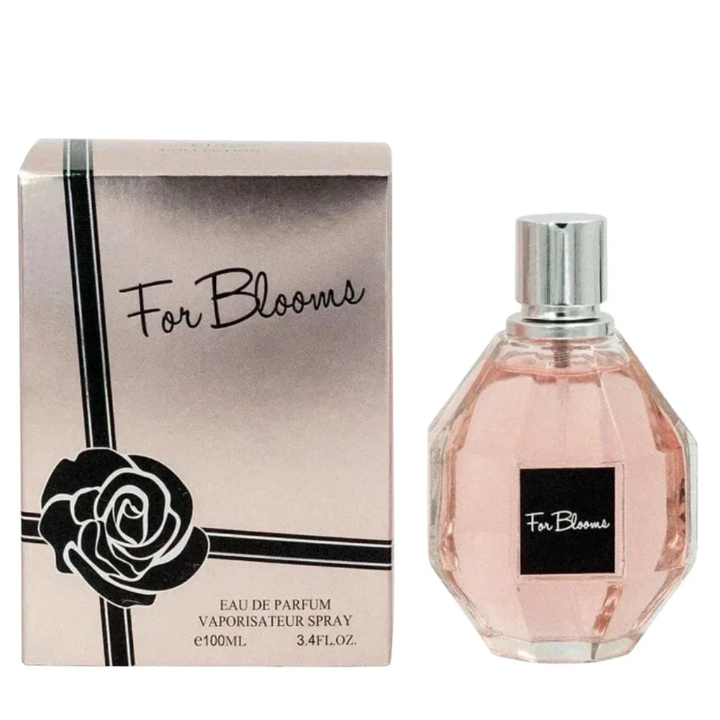 For Blooms 100ml Eau de Parfum in a faceted glass bottle with pink liquid next to its silver box featuring a black rose design.
