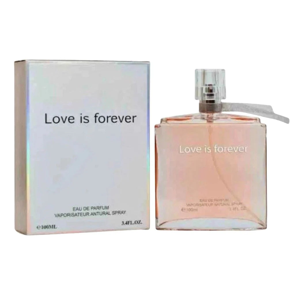 Love is Forever 100ml Eau de Parfum in a clear glass bottle with a silver cap and ribbon, standing next to its iridescent premium box.