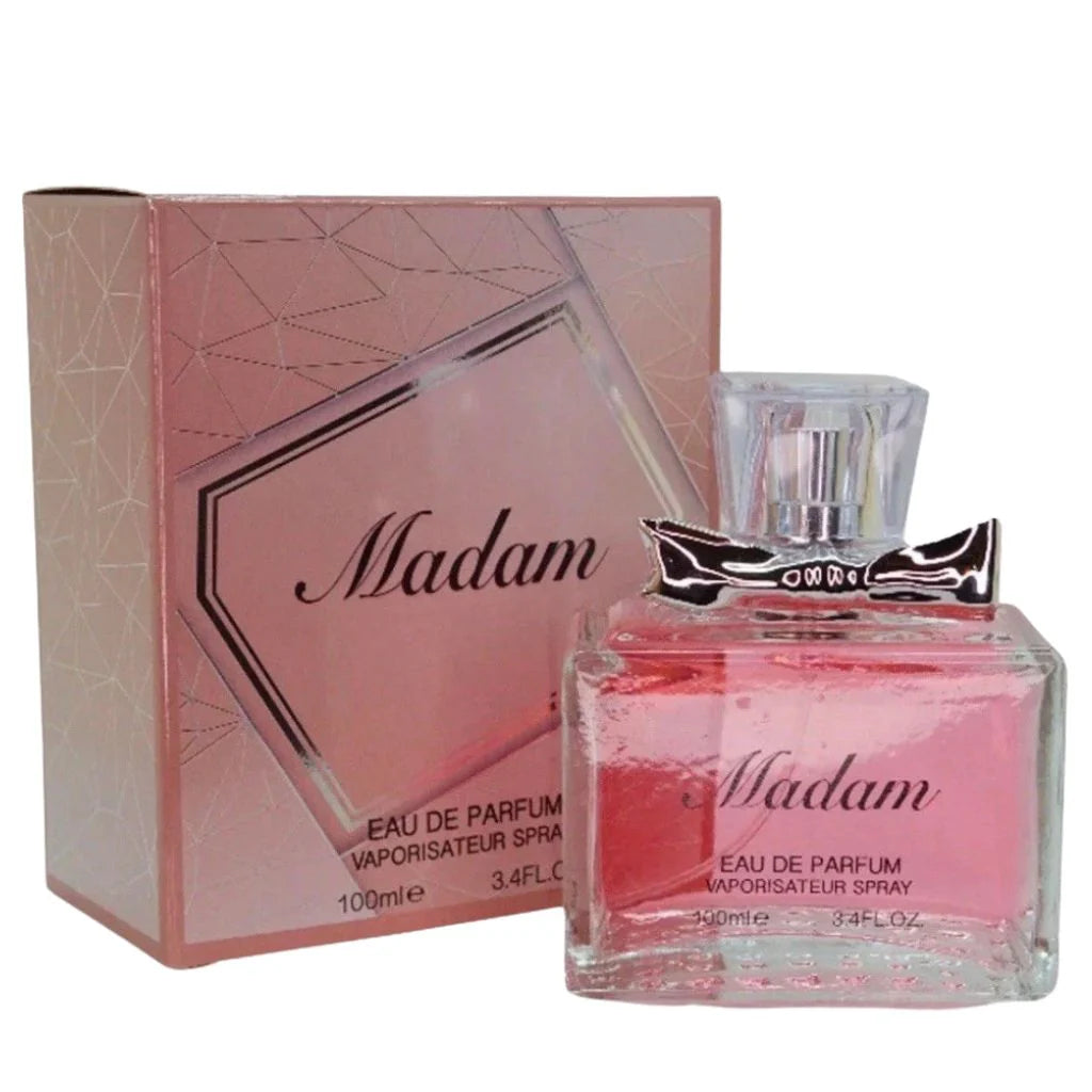 Madam 100ml Eau de Parfum in a rectangular clear bottle with pink liquid and a silver bow cap next to its matching pink geometric patterned box.