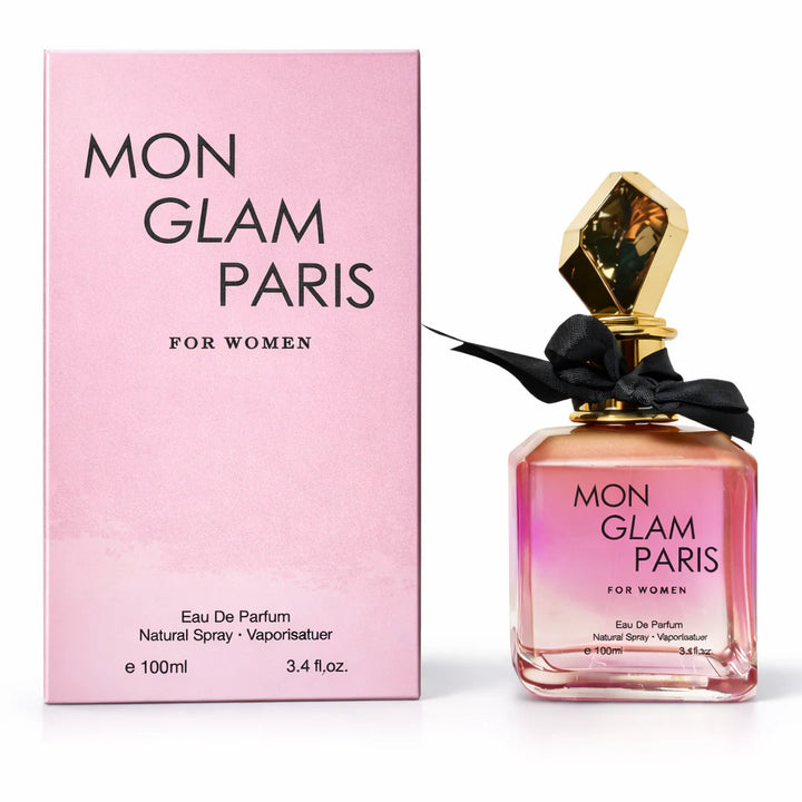 Mon Glam Paris 100ml Eau de Parfum in a clear glass bottle with a black bow accent and gold cap, standing next to its pink premium gift box.