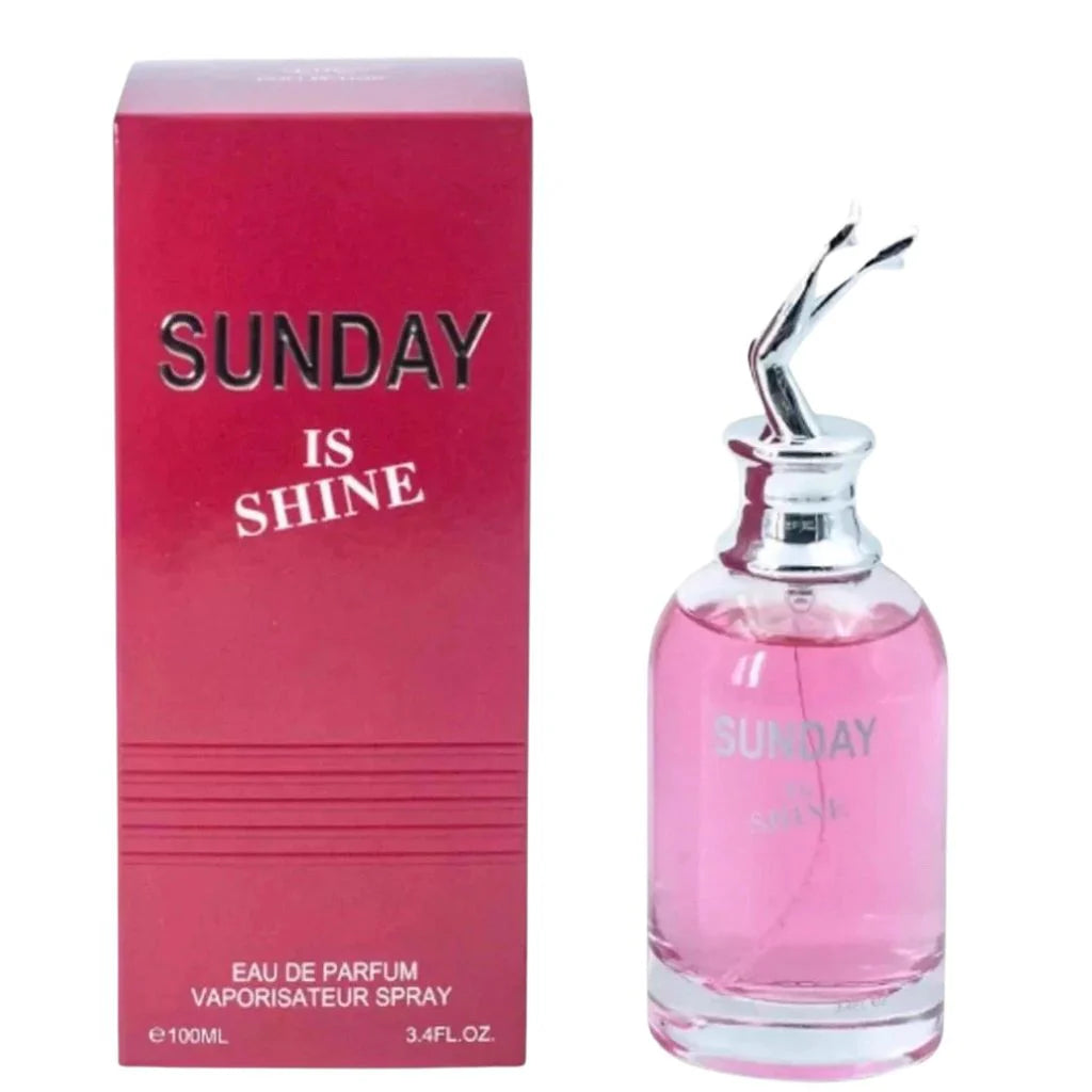 Sunday Is Shine 100ml Eau de Parfum in a clear glass bottle with pink liquid next to its vibrant pink rectangular box.