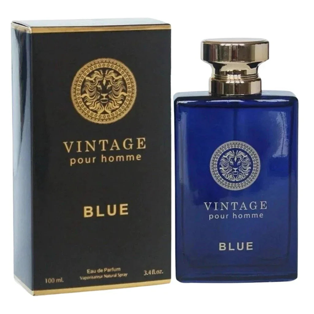 Vintage Pour Homme Blue Eau de Parfum 3.4 fl oz deep translucent sapphire blue glass bottle with a silver lion emblem, standing next to its matching black and gold presentation box.