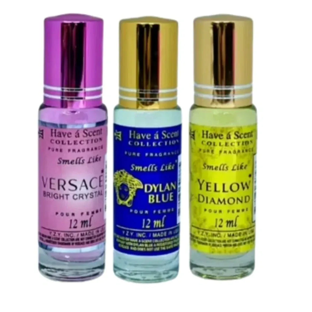 a trio of purple blue and yellow twelve milliliter roll on perfume oil bottles for women