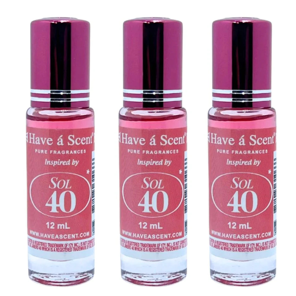 three identical pink labeled twelve milliliter roll on bottles of SOL-40 pure perfume oil for men with metallic magenta caps